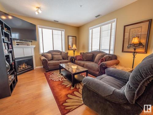 240 2503 Hanna Crescent, Edmonton, AB - Indoor Photo Showing Living Room With Fireplace