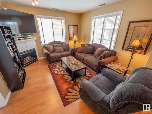 240 2503 Hanna Crescent, Edmonton, AB - Indoor Photo Showing Living Room With Fireplace