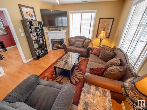 240 2503 Hanna Crescent, Edmonton, AB - Indoor Photo Showing Living Room With Fireplace