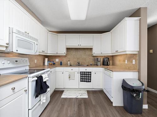 110 592 Hooke Road, Edmonton, AB - Indoor Photo Showing Kitchen With Double Sink