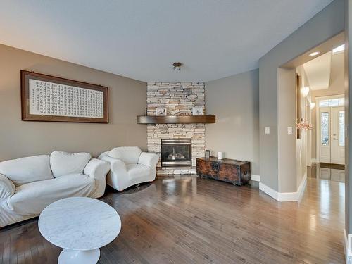 3007 Macneil Way, Edmonton, AB - Indoor Photo Showing Living Room With Fireplace