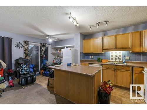 7931 7 Avenue, Edmonton, AB - Indoor Photo Showing Kitchen With Double Sink