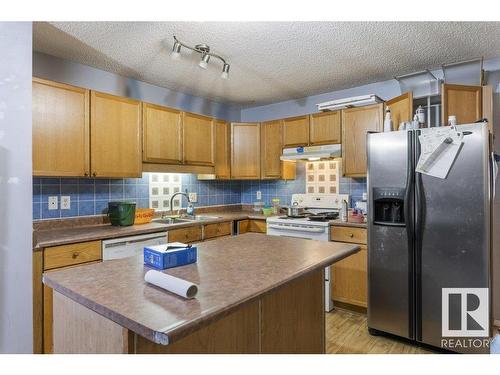 7931 7 Avenue, Edmonton, AB - Indoor Photo Showing Kitchen With Double Sink