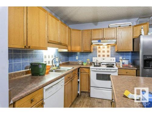 7931 7 Avenue, Edmonton, AB - Indoor Photo Showing Kitchen With Double Sink