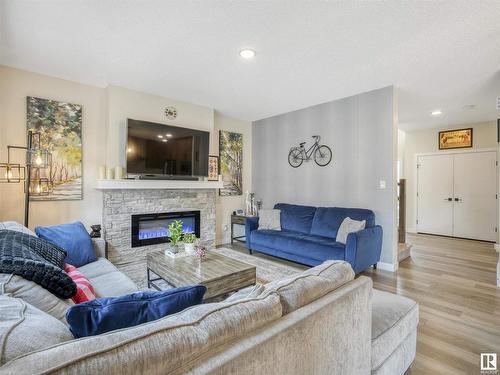 5320 22 Avenue, Edmonton, AB - Indoor Photo Showing Living Room With Fireplace