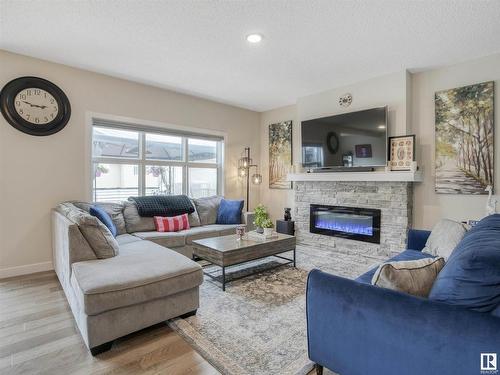 5320 22 Avenue, Edmonton, AB - Indoor Photo Showing Living Room With Fireplace