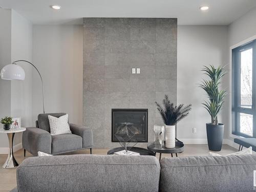 7179 May Crescent, Edmonton, AB - Indoor Photo Showing Living Room With Fireplace