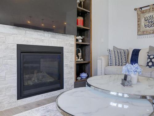 8452 Cushing Court, Edmonton, AB - Indoor Photo Showing Living Room With Fireplace