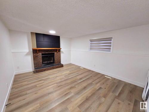 1135 49A Street, Edmonton, AB - Indoor Photo Showing Living Room With Fireplace