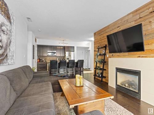 109 11203 103A Avenue, Edmonton, AB - Indoor Photo Showing Living Room With Fireplace