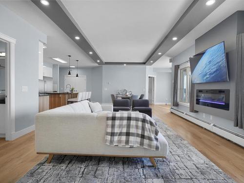 410 3719 Whitelaw Lane, Edmonton, AB - Indoor Photo Showing Living Room With Fireplace