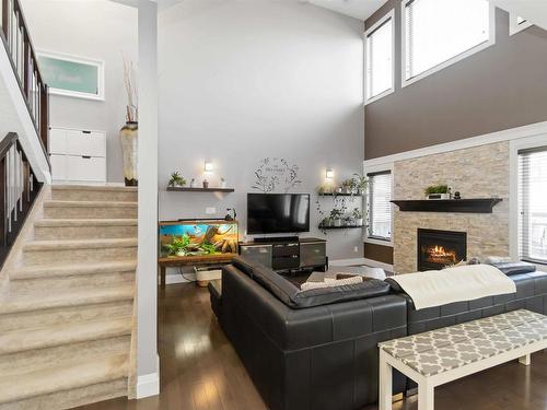 1532 Cunningham Cape, Edmonton, AB - Indoor Photo Showing Living Room With Fireplace