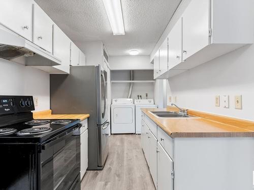 8439 29 Avenue, Edmonton, AB - Indoor Photo Showing Kitchen With Double Sink