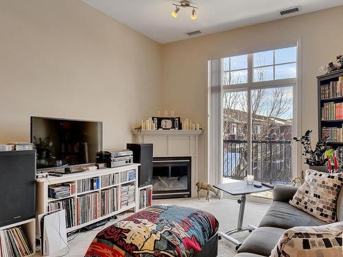 326 2503 Hanna Crescent, Edmonton, AB - Indoor Photo Showing Living Room With Fireplace