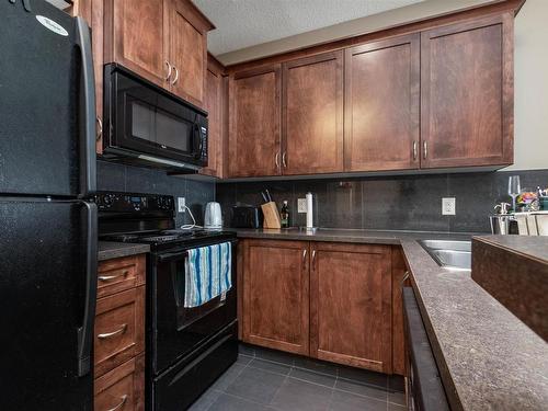 103 6720 112 Street, Edmonton, AB - Indoor Photo Showing Kitchen With Double Sink