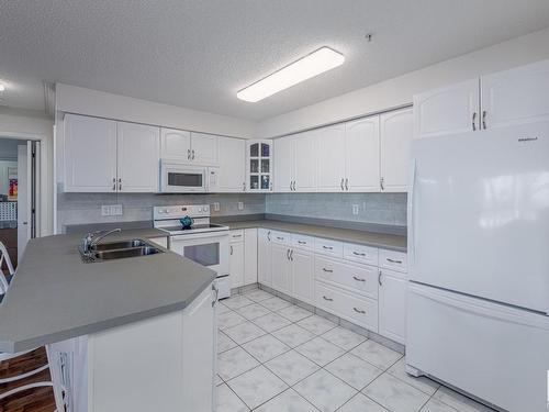 208 17150 94A Avenue, Edmonton, AB - Indoor Photo Showing Kitchen With Double Sink