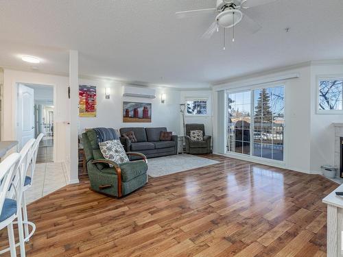 208 17150 94A Avenue, Edmonton, AB - Indoor Photo Showing Living Room With Fireplace