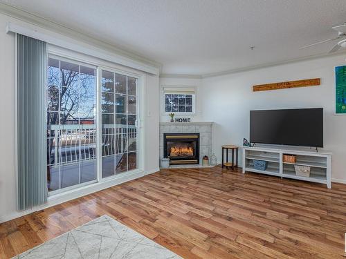 208 17150 94A Avenue, Edmonton, AB - Indoor Photo Showing Living Room With Fireplace