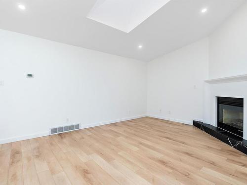 49 Jackson Road, Edmonton, AB - Indoor Photo Showing Other Room With Fireplace