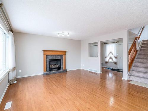 1209 Latta Crescent, Edmonton, AB - Indoor Photo Showing Living Room With Fireplace