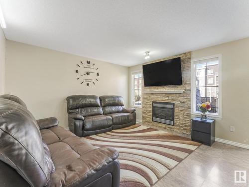 6418 16 Avenue, Edmonton, AB - Indoor Photo Showing Living Room With Fireplace