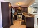 331 11603 Ellerslie Road, Edmonton, AB  - Indoor Photo Showing Kitchen With Stainless Steel Kitchen With Double Sink 