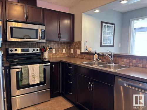 331 11603 Ellerslie Road, Edmonton, AB - Indoor Photo Showing Kitchen With Stainless Steel Kitchen With Double Sink