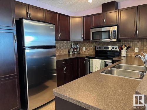 331 11603 Ellerslie Road, Edmonton, AB - Indoor Photo Showing Kitchen With Stainless Steel Kitchen With Double Sink With Upgraded Kitchen