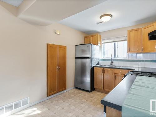 8735 92 Avenue, Edmonton, AB - Indoor Photo Showing Kitchen With Double Sink