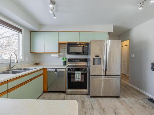 8612 152A Avenue, Edmonton, AB - Indoor Photo Showing Kitchen With Double Sink