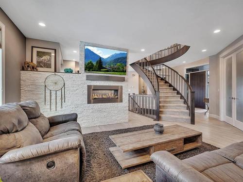 4510 Wingfield Bay, Edmonton, AB - Indoor Photo Showing Living Room With Fireplace