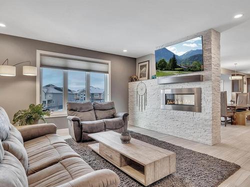 4510 Wingfield Bay, Edmonton, AB - Indoor Photo Showing Living Room With Fireplace