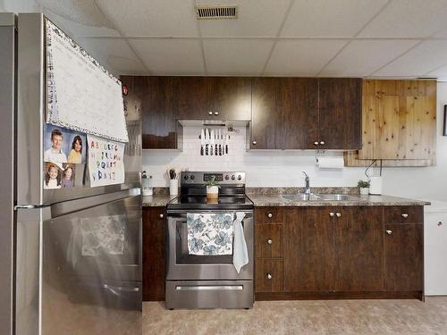 1230 62 St, Edmonton, AB - Indoor Photo Showing Kitchen With Double Sink