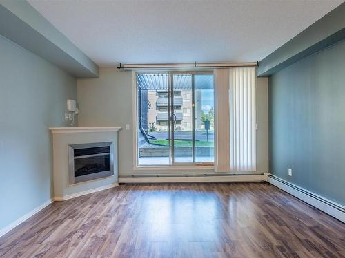 101 17011 67 Avenue, Edmonton, AB - Indoor Photo Showing Living Room With Fireplace