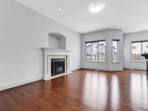 2832 16 Avenue Nw, Edmonton, AB - Indoor Photo Showing Living Room With Fireplace