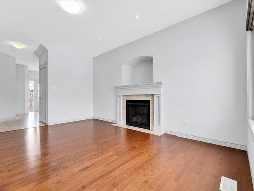 2832 16 Avenue Nw, Edmonton, AB - Indoor Photo Showing Living Room With Fireplace