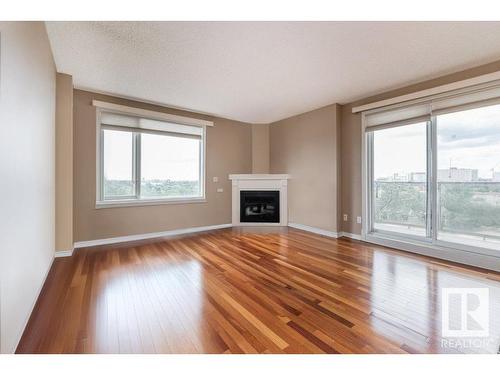 1001 10649 Saskatchewan Drive, Edmonton, AB - Indoor Photo Showing Living Room With Fireplace