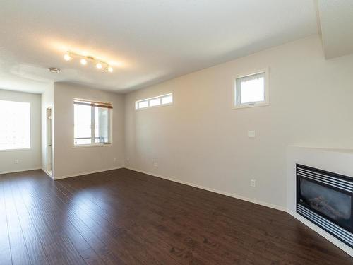 10 9856 83 Avenue, Edmonton, AB - Indoor Photo Showing Other Room With Fireplace