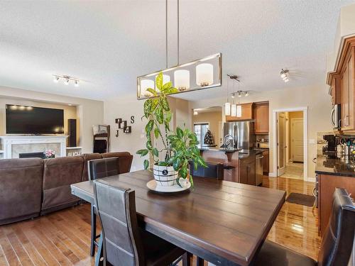 16724 60 Street, Edmonton, AB - Indoor Photo Showing Dining Room With Fireplace