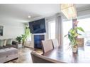 937 Ebbers Crescent Nw, Edmonton, AB  - Indoor Photo Showing Living Room With Fireplace 