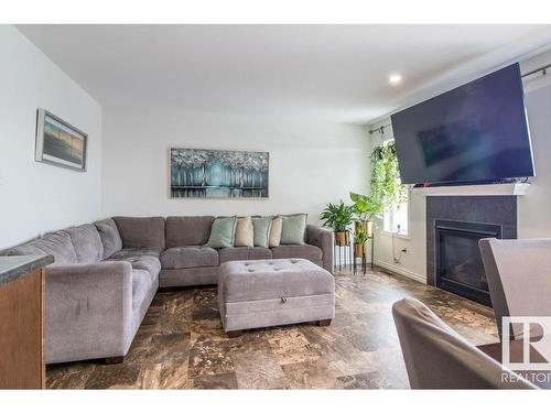 937 Ebbers Crescent Nw, Edmonton, AB - Indoor Photo Showing Living Room With Fireplace