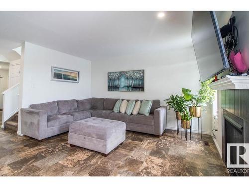 937 Ebbers Crescent Nw, Edmonton, AB - Indoor Photo Showing Living Room With Fireplace