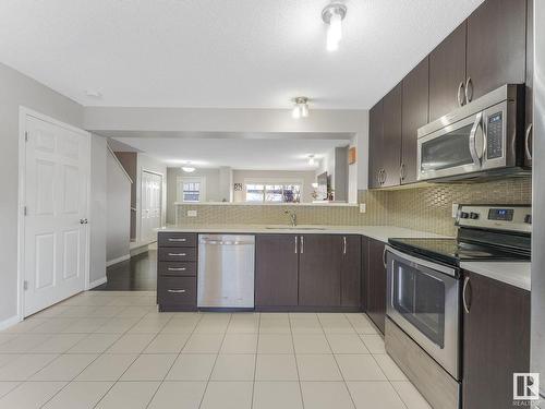 6930 23 Avenue, Edmonton, AB - Indoor Photo Showing Kitchen With Stainless Steel Kitchen