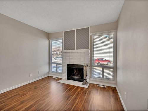 1113 62 Street, Edmonton, AB - Indoor Photo Showing Living Room With Fireplace