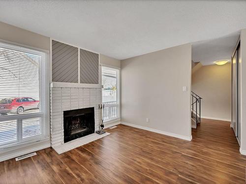 1113 62 Street, Edmonton, AB - Indoor Photo Showing Living Room With Fireplace