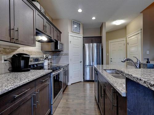 17095 38 Street, Edmonton, AB - Indoor Photo Showing Kitchen With Double Sink