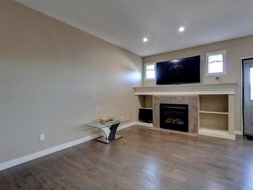 17095 38 Street, Edmonton, AB - Indoor Photo Showing Living Room With Fireplace