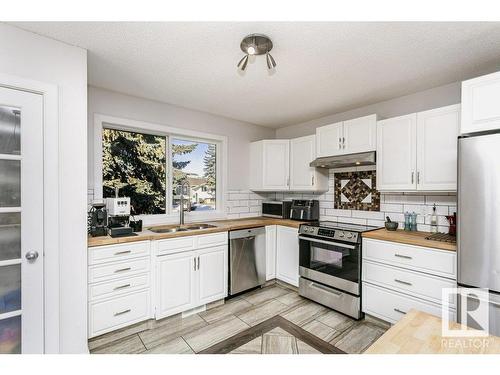 4676 16A Avenue, Edmonton, AB - Indoor Photo Showing Kitchen With Double Sink