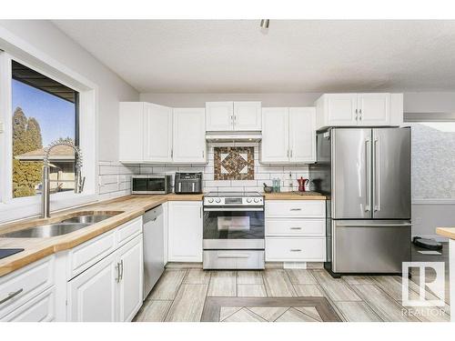 4676 16A Avenue, Edmonton, AB - Indoor Photo Showing Kitchen With Double Sink