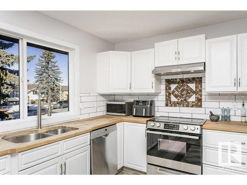 4676 16A Avenue, Edmonton, AB - Indoor Photo Showing Kitchen With Double Sink